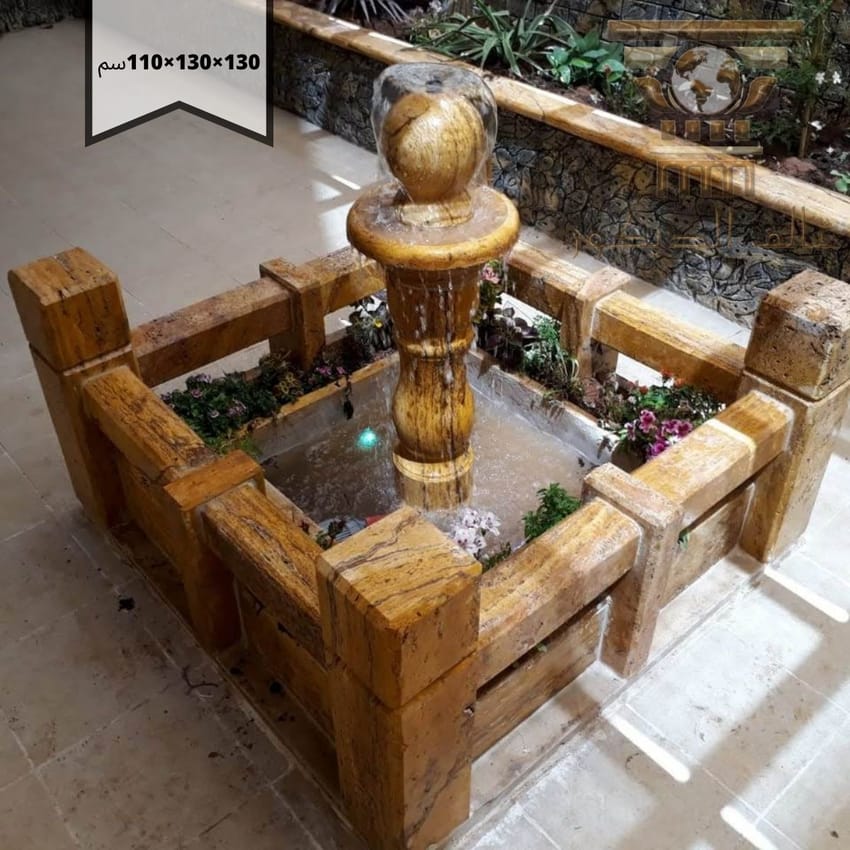 n1030… نافورة حجرية بلمسة ذهبية وكرة متحركة تمنح حديقتك حيوية وفخامة دافئة